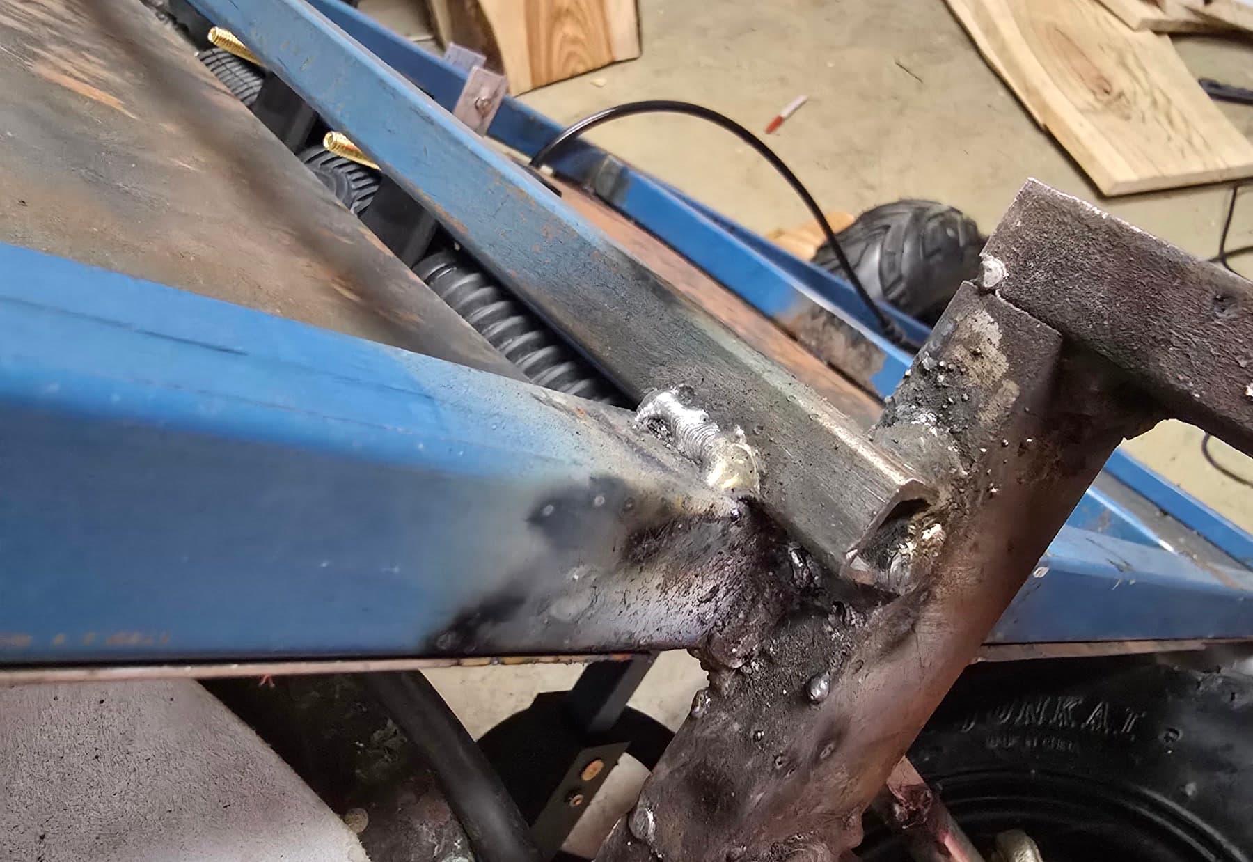 Close-up of welded steel joints on the custom go-kart chassis